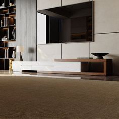 a living room with an entertainment center and bookshelves