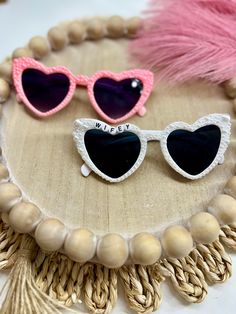 Did he finally put and ring on it? Customize you're very own sunglasses for you're Bach trip, wedding pics, honeymoon, or just to show off your new last name!  * * These glasses are decked out in pearls and can have anything words placed on them! * * PLEASE NOTE: Each pair are never the same and are uniquely different. Heart-shaped Glass Sunglasses For Gift, Heart-shaped Glass Sunglasses As Gift, Valentine's Day Gift Sunglasses With Tinted Lenses, Heart-shaped Sunglasses For Valentine's Day Gift, Fun Sunglasses As Valentine's Day Gift, Fun Sunglasses For Valentine's Day Gift, Heart-shaped Sunglasses With Tinted Lenses For Gift, Heart-shaped Sunglasses With Tinted Lenses As Gift, Heart-shaped Sunglasses With Uv Protection As Gift