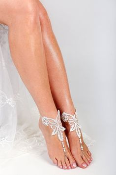 White Barefoot Sandals For Party, Elegant White Barefoot Sandals For Party, Elegant Adjustable Sandals For Bridal Shower, Beaded Open Toe Sandals For Wedding, Adjustable Barefoot Sandals For Wedding, White Ankle Strap Anklets For Party, Elegant Beaded Barefoot Sandals For Wedding, Elegant Adjustable Barefoot Sandals For Wedding, Adjustable Beaded Sandals For Wedding