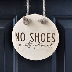 a sign that says no shoes is hanging on a door