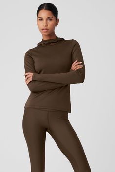 Feel instantly in the zone with the Airlift Winter Warm Hooded Runner. This action-ready, all-weather layering piece is made from sleek, performance Airlift fabric with a brushed interior for weightless warmth. A tall, built-in hood effortlessly defends against the cold. Pair it up with a high-impact bra and running shorts and go far. Winter Moisture-wicking 4-way Stretch Tops, Winter Hooded Activewear For Running, Hooded Winter Running Activewear, Technical Stretch Hooded Activewear, Alo Yoga Fitted Tops For Winter, Winter Running Stretch Outerwear, Functional 4-way Stretch Winter Tops, Functional Winter Tops With 4-way Stretch, Functional 4-way Stretch Tops For Winter