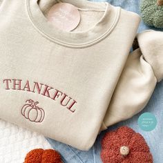 FALL Embroidered sweatshirt, Pumpkin Crewneck Sweatshirt Farm Fresh Pumpkin Patch, Pumpkin Sweater, Autumn Shirt Thanksgiving Sweatshirt,  PUMPKINS sweatshirt ---HOW TO ORDER---   FOR EACH SHIRT CHOOSE: **Shirt type, size and color (shirt shown is sand with #8 thread) ---UNISEX SIZING--   Please see size chart in the pictures ---PRODUCT DETAILS--- Gildan Crewneck UNISEX Sweatshirt 50% cotton, 50% polyester Pre-shrunk Air jet yarn for softer feel and reduced pilling Double-needle stitched collar, Fleece Top With Letter Embroidery And Long Sleeves, Long Sleeve Fleece Top With Letter Embroidery, Winter Crew Sweatshirt With Letter Embroidery, Fall Fleece Tops With Letter Embroidery, Fall Crew Sweats With Embroidered Logo, Winter Long Sleeve Sweatshirt With Embroidered Graphics, Embroidered Long Sleeve Winter Sweatshirt, Winter Embroidered Long Sleeve Sweatshirt, Cotton Long Sleeve Sweatshirt With Letter Embroidery