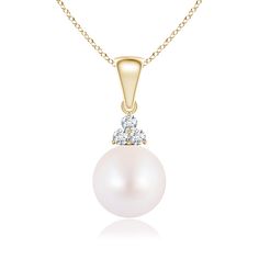 Suspended from a shiny metal bale, this pearl solitaire dangle pendant radiates elegance and beauty. The gorgeous Akoya cultured pearl enthralls with its luminous hue. A trio of brilliant prong set diamonds crown the pearl for added sparkle. This cultured pearl pendant is exquisitely crafted in 14k yellow gold. Diamond Crown, Akoya Pearls, The Pearl, Cultured Pearls, Pearl Pendant, 18k Rose Gold, Diamond Pendant, Prong Setting, Pearl Necklace