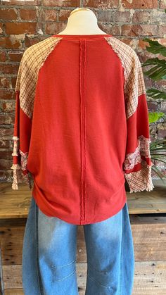 Get ready for Fall in our red peace and love top! Adorable mixed fabric heart shaped peace sign is perfect for our boho ladies. Would be perfect for a a fun game day look whn you want something a little more unique. Pairs great with our barrel jeans or our embroidered yoga flares! Looks cute with a front tuck, a side knit, or loose and flowy. Oversized fit - read measurements before buying. Fabric 100% Cotton Measurements taken flat S- Bust 24" Length 27" M- Bust 25" Length 27.5" L- Bust 26" Length 28" Bohemian Crew Neck Top For Layering, V-neck Festival Tops For Fall, Hippie Crew Neck Top For Fall, Red Cotton Patchwork Top, Bohemian Tops With Patchwork For Layering, Bohemian Tops With Patchwork, Red Cotton Tops For Layering, Casual Festival Tops For Fall, Casual Tops For Fall Festival