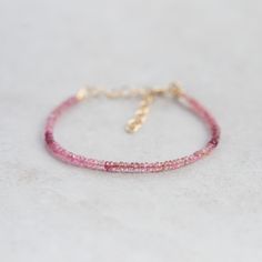 Want to save 15% off your first order? Sign up for our newsletter by visiting our website and filling out the pop up form. Receive a code by email, then send us that code through Etsy messages to save 15% off your ETSY order, sign up here: www.earthlyabundancejewelry.com  Pink Tourmaline: love, hope, matters of the heart D E T A I L S △ Handmade in Vancouver △ Genuine stones △ Stone size 3-3.5mm (roughly) △ 14K gold filled clasp and extender △ Gemstones are 100% genuine  L E N G T H Fits 6-8" ♡ Q U A L I T Y  The upmost quality and care goes into sourcing each and every material I use. Gemstones are sourced from Jaipur and Rishikesh, India and I hold stronger connections to my suppliers. I use 100% authentic gemstones, this is our guarantee (no synthetics or imitation stones).  HANDMADE wi Pink Gemstone Bracelet, Pink Tourmaline Jewelry, Rishikesh India, Peridot Bracelet, Citrine Bracelet, Tourmaline Bracelet, Tourmaline Jewelry, Gemstone Beaded Bracelets, Pink Gemstones