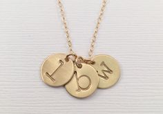 "This beautiful gold filled, rose gold, or sterling silver initial necklace is the perfect children's initial necklace for mom. Get an initial disc to represent each of your children's or grandchildren's names. The perfect gift for Mom or Grandma. This makes a great mother's day gift, birthday present, christmas present, push present, graduation gift, anniversary gift, or a gift for yourself! Personalize the necklace with any number of initial discs. Available in hammered or satin finish. D E T Personalized Gold Initial Necklace For Mom, Personalized Gold Initial Necklace As Gift For Mom, Gold Initials Charm Necklace As Gift For Mom, Gold Initials Charm Necklace For Mom, Rose Gold Initial Necklace, Initial Tag Necklace, Necklace With Kids Names, Mom Necklace Personalized, Sterling Silver Initial Necklace