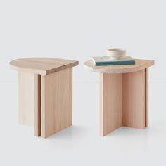 two wooden tables sitting next to each other