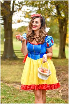 a woman dressed as snow white holding a basket