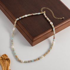 Freshwater Baroque Pearl & Natural Shoushan Stone This unique necklace combines the natural beauty of colorful Shoushan stone and baroque pearls, evoking a sense of artistic nostalgia and the carefree spirit of seaside holidays. Crafted with attention to detail, this necklace exudes a bohemian vintage charm. The co Bohemian Pearl Necklace For Jewelry Making, Bohemian Pearl Necklace With Pearl Charm, Bohemian Style Pearl Necklace With Pearl Pendant, Bohemian Beach Jewelry With Pearl Chain, Bohemian Beaded Baroque Pearl Necklace, Bohemian Baroque Pearl Chain Necklace, Baroque Pearl Necklaces With Natural Stones And Round Beads, Baroque Pearl Necklaces With Natural Stones, Bohemian Pearl Pendant Necklace With Round Beads