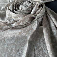 Exquisite merino wool shawl in soft,  beige shades, decorated with an eternal pattern of paisley, which adorns the entire space of this accessory. Made of high quality merino wool, this shawl combines the highest quality with a delicate, delicate weave that provides unprecedented warmth and comfort. If you dress for a special occasion or add a little luxury to your everyday clothes, this shawl will be the embodiment of cozy sophistication. Plunge into elegance and experience the unrivalled charm Formal Elegant Pashmina Shawl, Elegant White Pashmina Dupatta, Cream Pashmina Dupatta For Wedding, Wedding Cream Pashmina Shawl, Bohemian Pashmina Scarf For Weddings, Bohemian Pashmina Scarves For Wedding, Beige Pashmina Scarf For Wedding, Elegant Cream Pashmina Shawl, Bohemian Pashmina Wedding Scarf