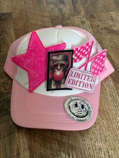 a pink hat with an image of a clown on it