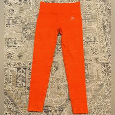 A New Pair Of Nice Gym Shark Leaving In A Pretty Orange Color Perfect For Fall. Or Even Just Workout Or Cute Little Daily Outfit. Almost Brand New With Absolutely No Rips Or Stains. Pretty Orange Color, Orange Gym, Pretty Orange, Gym Shark, Gymshark Leggings, Daily Outfits, Orange Color, Pant Jumpsuit, Pants For Women