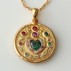 14k Gold Multi Gemstone Disc Pendant, Gold Mandala Heart Round Pendant, Multi Stone Mandala Heart Disc Pendant, Designer Gemstone Pendant ♦️ ITEM     D E T A I L S ♦️ ✦ Name : Heart Disc Pendant ✦ Metal : 925 Silver ✦ Size : 25MM ✦ Stone : Multi gemstone                                                                                 SIXTH SENSE JEWELS ✦ Our all design are made to order. We need 6 to 8 days for making and delivery to depend on the shipping method you select. ✦Product & gemstone weight may vary from actual products. ✦All are designed and handmade in-house by me and team with precision, Perfect craftsmanship and strong interest! ✦We are continuously listing new products in our store. So keep coming back to see more great updates in the store. ✦Wholesale orders With Custom are Gold Pendant Heart Necklace With Gemstone, Gold May Birthstone Heart Necklace, Gold Heart Necklace For May Birthstone, Gold Heart Necklace With Gemstone For Anniversary, Gold Multi-stone Necklace For May Birthstone, Gold Heart Necklace With May Birthstone As Gift, Yellow Gold Heart Necklace With Birthstone, Anniversary Heart Necklace With 17 Jewels, Heart Pendant Multi-stone Jewelry Gift