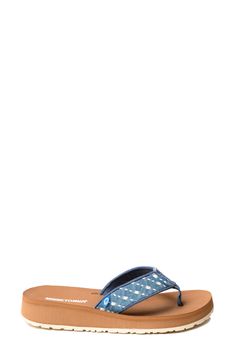 A cushioned footbed and thick rubber sole lend comfortable support to a stylish flip-flop secured with a center toe post. Cushioned footbed Textile upper and lining/rubber sole Imported Casual Flip Flops With Branded Insole And Toe Post, Casual Toe Post Flip Flops With Ortholite Insole, Casual Slippers With Ortholite Insole And Toe Post, Blue Leather Casual Flip Flops, Casual Blue Leather Flip Flops, Denim Blue Round Toe Sandals For Beach, Denim Slip-on Sandals For The Beach, Denim Blue Sandals For The Beach, Casual Flip Flops With Cushioned Footbed