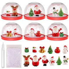 snow globes with santa and other christmas decorations