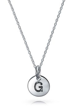 Personalize your look with this sterling-silver necklace complete with a circular initial pendant. 18" length Sterling silver Imported Sterling Silver Initial Necklace With Charms, Sterling Silver Round Pendant Initial Necklace With Charms, Everyday Round Initial Necklace With Charms, Dainty Silver Initial Necklace With Charms, Silver Initial Pendant Necklace With Charms, Silver Initial Necklace With Pendant Charms, Classic Sterling Silver Initial Pendant Charm Necklace, Silver Monogram Dainty Charm Necklace, Silver Pendant Initial Necklace With Charms