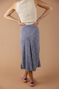 Adorned with dainty florals, this skirt brings a touch of feminine charm to any occasion. Whether you're dressing up for a special night out or keeping it casual, this skirt's timeless cut and pattern makes for the perfect style companion. slight high-low elastic waist unlined darkseagreen // paired with the hold your horses graphic tee steelblue // paired with the patti button tank Hold Your Horses, Perfect Things, Tank Bodysuit, Perfect Style, Pattern Making, High & Low, High Low, Graphic Tee, Midi Skirt