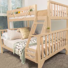 a wooden bunk bed sitting next to a window