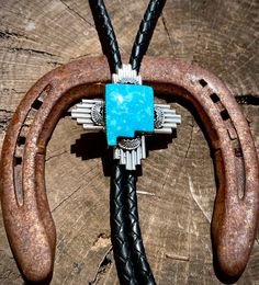 Emerson Delgarito Zia symbol bolo tie. Artisan Lariat Jewelry For Rodeo, Traditional Adjustable Jewelry For Rodeo, Southwestern Blue Bolo Ties As A Gift, Southwestern Blue Bolo Tie For Gift, Hand Tooled Western Bolo Ties As Gift, Western Style Hand Tooled Bolo Ties As Gift, Western Style Concho Bolo Tie For Gift, Artisan Bolo Ties With Adjustable Length, Blue Handmade Bolo Tie Gift