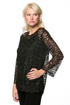 BTT-02451 Stylish and lovely, this lace top is sure to make an impression on any occasion. Perfect for formal and casual events, the lace set features a chic, long sleeve top with a rounded neck and a scalloped hem. The sleeves have a slight flare at the cuff that gives this set an extra dash of refinement. Five buttons in the back secure this trendy lace blouse. The sheer blouse goes over a simple black tank top. Material: Tank Top: 93% Polyester, 7% Spandex, Blouse: 100% Cotton Care Instructio Chic Black Top With Scalloped Lace, Crew Neck Lace Blouse, Elegant Black Top With Scalloped Lace, Lace Top With Lace Sleeves And Crew Neck, Elegant Black Tops With Scalloped Lace, Lace Tops With Crew Neck And Lace Sleeves, Elegant Black Scalloped Lace Top, Black Lace Top With Crew Neck, Black Lace Tops With Lace Cuffs