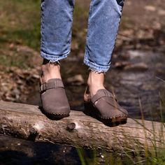 Experience the perfect blend of style, comfort, and tradition with our elegant grey Nubuck leather clogs. These handmade wooden shoes are a testament to skilled craftsmanship and sustainable fashion. Product Description: ✔ Premium Quality Material: Crafted from top-notch grey Nubuck leather, these clogs offer a soft, luxurious feel and high durability. The neutral color lends an elegant touch to your outfit, ensuring versatile styling options. ✔ Unparalleled Comfort: Designed with your comfort i Comfortable Outdoor Clogs With Buckle Closure, Comfortable Clogs With Buckle Closure And Flat Heel, Gray Leather Slip-on Sandals, Fall Clogs With Leather Sole And Flat Heel, Fall Leather Footbed Clogs With Flat Heel, Fall Flat Heel Clogs With Leather Footbed, Fall Clogs With Leather Footbed And Flat Heel, Brown Outdoor Clogs With Buckle Closure, Fall Leather Footbed Clogs With Closed Toe