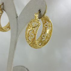 💎 Finely Crafted Jewelry. Made by master goldsmiths in Istanbul in our workshop. ❤️ Enjoy 18K gold for Less! What you see is gold, what touches your skin is 18k gold. ✓ Instant Glamour and Comfort - Statement Hoop Earrings ✓ Classic Timeless Filigree Hoop Earrings Design ✓ Length: 30 mm | 6/5 inch ✓ Width: 10 mm | 2/5 inch 100% Customer satisfaction guaranteed! Hassle free returns or exchanges. Reach out if you have any special requests and we'll make it happen! OTHER INFORMATION ✓ All items ar Italian Gold Earrings, Christmas Tree Gifts, Byzantine Jewelry, Filigree Hoop Earrings, Plating Techniques, Tree Gifts, Gold Filigree Earrings, Medium Hoop Earrings, Statement Hoop Earrings