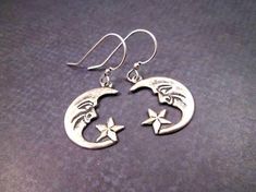 "Oxidized silver \"Man in the moon\" crescent pendants (18mm) on french hook ear wires. These earrings will dangle one and 1/4 inches from your ears.... See more of my designs here; justEARRINGS.etsy.com More Crescent Moon earrings here: https://www.etsy.com/shop/justearrings?search_query=crescent And please visit my sister~shops; justCHARMING.etsy.com & BohoDreamJewelry.etsy.com All of my jewelry shops offer FREE SHIPPING! Highlights: handmade jewelry, moon and star earrings, man in the moo Crescent Moon And Star, Man In The Moon, Moon Crescent, Butterfly Wing Earrings, Moon And Star Earrings, In The Moon, Crescent Moon Earrings, Moon And Star, Silver Dangle Earrings