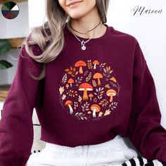 Mushrooms and Leaves Unisex Crewneck Sweatshirt | Wild Mushroom Cottagecore Jumper | Nature Forest Lover Jumper  ✔️ Super comfy unisex heavy blend crewneck sweatshirt  ✔️ 50% cotton 50% polyester ✔️ Medium-heavy fabric (8.0 oz/yd² (271.25 g/m ✔️ No side seams ✔️ Ribbed knit elastic collar to help collar retain its shape ✔️ Sewn-in label 📏 Runs true to size ✨ Care instructions: Machine wash: cold (max 30C or 90F). Turn inside out before washing to protect the print. Non-chlorine: bleach as neede Cotton Fall Sweatshirt With Mushroom Print, Cotton Sweatshirt With Mushroom Print, Cotton Sweatshirt With Mushroom Print For Fall, Casual Fall Sweatshirt With Mushroom Print, Cotton Long Sleeve Sweatshirt With Mushroom Print, Casual Mushroom Print Sweatshirt For Fall, Fall Mushroom Print Crew Neck Sweatshirt, Casual Long Sleeve Top With Mushroom Design, Winter Cotton Tops With Mushroom Print