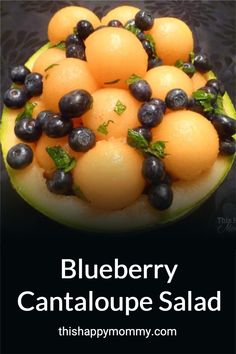 blueberry cantaloupe salad in a melon bowl