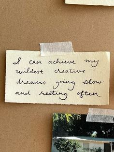 a piece of paper that has been pinned to a bulletin board with writing on it