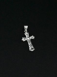 Add some divine style to your wardrobe with our Silver Cross Pendant. Made of shining silver, this pendant is a symbol of faith and fashion all in one. Height: 3.1 cm Note: Silver items will tarnish over time as a reaction to moisture in the air. A gentle clean with a silver cleaning solution will restore to original state. Sterling Silver Cross Charms For Anniversary, Sterling Silver Cross Jewelry For Anniversary, Sterling Silver Cross For Anniversary, Symbolic Silver Hypoallergenic Jewelry, Silver Cross Jewelry Symbolic Style, Silver Cross Jewelry With Symbolic Style, Silver Symbolic Cross Necklace, Silver Sterling Silver Cross Necklace, Symbolic Silver Cross Jewelry