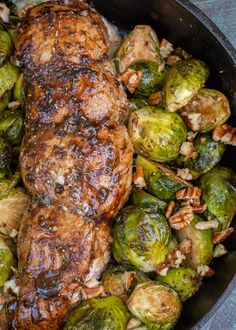 a pan filled with meat and brussel sprouts