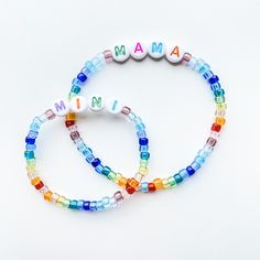 Treat yo' self or your best mom friend to a cute, colorful bracelet set with MAMA and MINI brightly beaded! Length and text fully customizable.  Stackers will coordinate evenly with bracelet sizes selected unless otherwise requested.  Sets may be MAMA/MINI, two adults, or two kids. Please indicate your choice in order personalization notes.  Standard lengths are 7" for women, 8" for men, 5.5" for kids. **Please double check all personalization details and requests. All bracelets are custom made Personalized Multicolor Beaded Bracelets, Customizable Multicolor Friendship Bracelets For Everyday, Playful Multicolor Beaded Bracelets For Personalized Gift, Playful Multicolor Beaded Bracelets For Mother's Day, Customizable Multicolor Friendship Bracelets, Multicolor 8mm Beads Jewelry For Mother's Day, Personalized Adjustable Rainbow Beaded Bracelets, Multicolor Personalized Friendship Bracelets For Mother's Day, Multicolor Friendship Bracelets As Personalized Gifts For Mother's Day