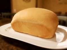 a loaf of bread sitting on top of a white plate