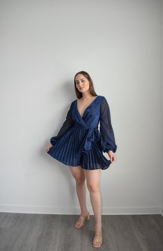 Navy Dress Romper Chic V-neck Party Dress With Tie Waist, Glamorous Long Sleeve V-neck Dress For Date Night, Spring V-neck Belted Dress For Date Night, Elegant V-neck Belted Dress For Evening, Formal V-neck Belted Dress With Tie Waist, Glamorous Spring Evening V-neck Dress, Glamorous Spring V-neck Party Dress, Cocktail V-neck Belted Mini Dress, Dressy V-neck Dress For Night Out In Spring