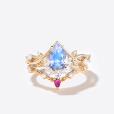 https://bbbgem.com/product/14k-gold-pear-rainbow-moonstone-engagement-ring-leaf-diamond-ring/ #BBBGEM #GiftIdeas Opal Wedding Set, Morganite Wedding Set, Rainbow Moonstone Engagement Ring, Engagement Ring Leaf, Moissanite Wedding Set, Ring Pop, Moonstone Engagement, Moonstone Engagement Ring, Handmade Fine Jewelry