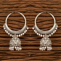 The striking look of this pair of earrings lets you captivate the beholders in a sophisticated way. Height = 65 mm || Width = 23 mm Classic Bali Antique Earring Handmade Design 100% Satisfaction Guarantee: Long Lasting Plating, High-Quality Stones. Gifting: This pair of charming earrings come in a beautiful gift box, making it an ideal gift for birthday, wedding anniversary or wedding gift. Occasion: Perfect choice for any Indian occasion. Care: It is advisable that you keep our products away fr Silver Bollywood Chandbali Jhumkas, Bollywood Style Intricate Silver Hoop Earrings, Heavy Chandbali Metal Hoop Earrings, Silver Bollywood Hoop Earrings With Intricate Design, Bollywood Style Silver Metal Chandbalis, Heavy Metal Chandbali Hoop Earrings, Silver Chandbali Bollywood Danglers, Heavy Metal Hoop Earrings For Festive Occasions, Festive Heavy Metal Hoop Earrings