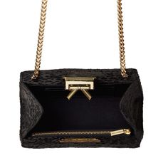 Handmade in New York, the Grace bag is crafted of black satin with a black and silver embroidery. Features a signature bow detail and gold hardware closure. Designer Evening Bags With Detachable Strap, High-end Black Formal Bags, High-end Evening Satchel Shoulder Bag, Luxury Shoulder Bag With Gold-tone Hardware For Events, High-end Black Shoulder Evening Bag, Luxury Evening Bags With Detachable Strap, High-end Evening Shoulder Bag, High-end Evening Bag With Detachable Handle, High-end Formal Shoulder Bag With Dust Bag