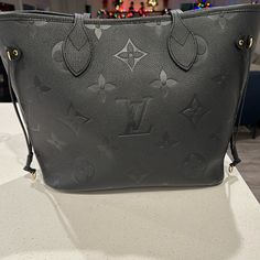 This Bag With Tax Totals 2879 See Picture Inserted. Only Wore A Couple Of Times. No Scuffs Tears Or Marks. Does Not Have Pouch. Comes With Dust Bag 12.2 X 11 X 5.5 Inches (Length X Height X Width) Black Embossed Cowhide Leather Cowhide-Leather Trim Microfiber Lining Gold-Color Hardware Hook Closure Inside Zipped Pocket 4 Side Laces Handle:Double Monogram Bags For Daily Use, Designer Black Bags With Monogram Print, Black Monogram Canvas Bag With Monogram Print, Black Monogram Canvas Bags With Monogram Print, Luxury Leather Bag With Monogram Print, Luxury Leather Bags With Monogram Print, Luxury Black Bag With Monogram Print, Modern Leather Bag With Monogram Print, Luxury Black Bags With Monogram Print