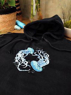 Hey, I'm happy to share my new project with you :)  Water Color Jellyfish Embroidered on Crewneck Sweatshirt, Hoodie Inspired by nature, organic elements and love.  Here's how to wash and take care of your next favorite sweatshirt/hoodie:  1. When to wash the sweatshirt ? I personally don't think that you need to wash it after every use. It needs to be washed after a few wears (five or six).  2. Which washing machine program should you use?  Turn the sweatshirt inside out and use the delicate or hand wash programs to respect the material. Unisex size for adults. Unisex size with variable sizes from XS to 3XL. Enjoy and contact me if you have any questions! Shark Gifts, Organic Elements, Diy Clothes Design, Embroidery Hoodie, Embroidered Art, Blue Pullover, Outfit Inspo Casual, Art Sea, Embroidered Sweatshirt