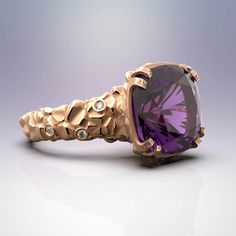 Discover the elegance of Italian craftsmanship with our stunning Amethyst Gold Ring featuring diamonds and central amethyst gemstone. This statement piece from Oltremare Gioielli is finely textured and made with 18k or 14k gold, perfect for February birthdays or as a captivating cocktail ring. Explore exquisite fine jewelry, meticulously crafted in Italy. At the center of the ring sits a mesmerizing amethyst gemstone, radiating its signature deep purple hue. This enchanting gemstone symbolizes tranquility and spiritual protection, making it a meaningful choice for any wearer. Surrounding the amethyst, the shank of the ring is adorned with small, dazzling diamonds, delicately placed to accentuate the natural beauty of the design. ❥Details Gemstones Amethyst: Shape: fancy cut Measurements: a Purple Amethyst Ring With Diamond And Gemstone Accents, Amethyst Ring With Diamond And Gemstone Accents, Purple Amethyst Ring With Diamond Accents, Modern Diamond Amethyst Ring, Modern Purple Amethyst Ring With Accent Stones, Modern Amethyst Diamond Ring, Gold Luxury Amethyst Gemstone Ring, Luxury Multi-stone Gold Amethyst Ring, Statement Gold Ring