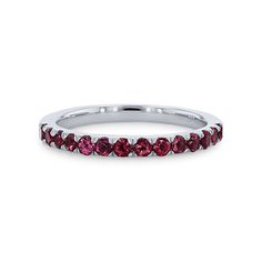 a white gold band with red stones