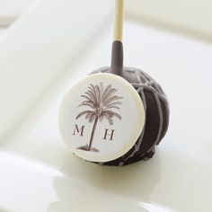 a chocolate covered candy with a palm tree on it