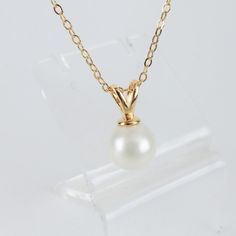 "Simple and Elegant Hamilton Gold Shell Pearl Necklace that won't tarnish easily. Chain 20\", adjustable to 22\". Great quality, suitable for gifts and are long lasting. What is Hamilton Gold? Hamilton Gold is a special high quality base metal coating that holds up very well, great color that will match all skin tones. What is \"Shell Pearl\"? Shell Pearls keep their color and shine and will not be affected by sweat/perfume. Made from the inner lining of oyster shells ground to a fine powder, sh White Birthstone Necklace For Formal Occasions, Formal White Birthstone Necklace, Classic Pearl White Jewelry With Clavicle Chain, Classic White Birthstone Necklaces, White Birthstone Necklace With Round Cut, White Round Cut Birthstone Necklace, Classic White Round Pendant Jewelry, Pearl Charm Round Necklace For Anniversary, Round Pearl Charm Necklace For Anniversary