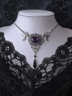 Elevate your gothic ensemble with our exquisite necklace. This stunning piece features intricate floral carvings and a mesmerizing purple gemstone, exuding an air of mystery and elegance. The rhinestone pendant adds a touch of glamour, making it a versatile accessory for both casual and formal occasions. Embrace the allure of Gothic fashion with this unique and timeless necklace, perfect for adding a touch of vintage charm to your wardrobe.  Please note that this product includes only the necklace. Garment Size SizeFree SizeFull Length37+5 Gothic Metal Necklaces With Jewels, Gothic Crystal Jewelry For Gift, Purple Filigree Pendant Necklace, Purple Pendant Necklace With Filigree, Gothic Filigree Pendant Jewelry, Gothic Purple Metal Jewelry, Fantasy Style Amethyst Purple Jewelry, Fantasy Style Purple Amethyst Jewelry, Purple Amethyst Fantasy Jewelry