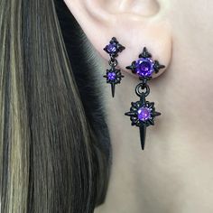 The Starburst stud earrings with Purple Glass stones are the perfect accessory for those who love gothic and celestial styles. The dreamy Blue stone  adds a touch of elegance, making them a beautiful addition for both men and women. With their unique design and high-quality materials, these earrings are a must-have for any fashion-forward individual. Sold as Pair Material: 316 Stainless steel Large stars: 36mm long /14 mm wide Small Stars: 22mm long/  9mm wide Standard post 21G Closure: butterfly push back Listing for pair of stud only *RETURNS / REFUNDS * -If you would like to return you purchase , please contact us within 7 days of receiving your package and we will accept the return.Return will only be made to the product, and not the shipping cost.  -Buyer is  responsible for the retur Cheap Purple Star-shaped Jewelry, Punk Style Star Charm Jewelry As Gift, Edgy Star-shaped Pierced Earrings, Edgy Star-shaped Earrings For Gift, Black Star-shaped Earrings For Pierced Ears, Edgy Purple Jewelry As Gift, Edgy Purple Jewelry For Gifts, Edgy Purple Jewelry For Gift, Gothic Star-shaped Pierced Earrings