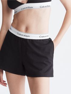 Our most iconic program, rooted in our past and reimagined for our future. These Calvin Klein modern cotton lounge sleep shorts are made from soft cotton and recycled polyester jersey for a partly sustainable design. Finished with a classic logo waistband, side pockets and seaming details. Modern Calvin Klein Cotton Bottoms, Calvin Klein Cotton Bottoms With Logo Waistband, Calvin Klein Cotton Bottoms With Elastic Waistband, Calvin Klein Casual Bottoms With Logo Waistband, Cotton Bottoms With Logo Waistband For Loungewear, Summer Loungewear Bottoms With Logo Waistband, Sporty Calvin Klein Cotton Bottoms, Sporty Cotton Pajama Shorts For Daywear, Sporty Short Cotton Sleepwear