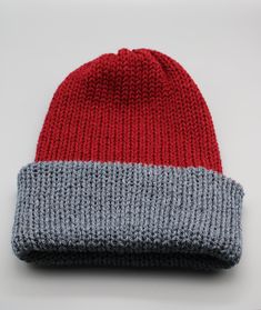 A beautiful handmade knitted hat in wine/red and black. It is double layered for extra warmth. Can be worn slouchy or as a beanie with folded brim. And best of all.... its reversible!! So you get to choose, do you want to wear it as a wine hat with grey brim, or grey hat with wine brim? The choice is yours!  This versatile hat is ideal for the cold Winter season! *Actual colours may vary slightly due to different device screen settings. Red Beanie One Size Fits Most, Red Beanie Hat, One Size Fits Most, Red Winter Beanie One Size Fits Most, Red Winter Beanie, One Size Fits Most, Red Beanie For Cold Weather, Red Knitted Beanie For Winter, Red Knitted Beanie One Size, Red Knitted Winter Beanie, Red Knitted Beanie (one Size Fits Most)