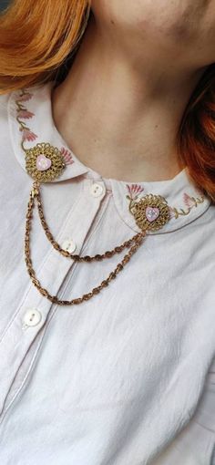 "These collar pins have been made with only true vintage pieces from different origins: hearts made of copper in the 60s with an enamel finish with a rose into them. They are set on gold bronze tone filigree with beautiful details, from the 80s West Germany, made of a sturdy metal looking plastic and measuring 30mm / 1.18\" in diameter. The beautiful hanging chain is made of brass. (80s). CONDITION is perfect and unused vintage from New Old Stocks around the world. More collar pins in this style Vintage Brooches With Decorative Buttons As Gift, Vintage Brooches As A Gift With Decorative Buttons, Handmade Metal Brooches For Gifts, Handmade Metal Brooches As Gifts, Vintage Metal Brooches For Gift, Victorian Metal Brooches As Gift, Vintage Handmade Enamel Pin Gift, Gold Victorian Brooches With Vintage Charm, Victorian Gold Metal Brooches