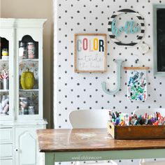 the wall is decorated with black and white polka dots, such as letters on it